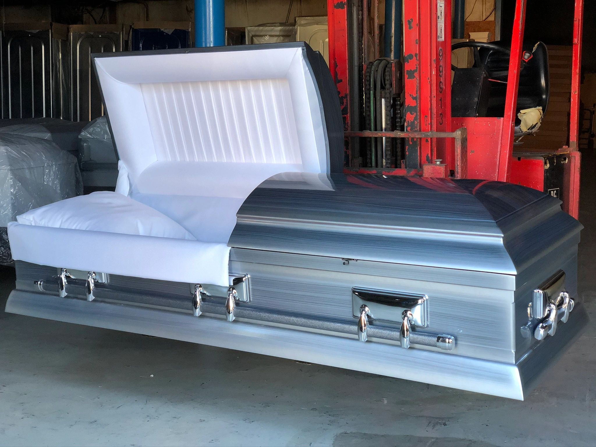 {"blocks":[{"key":"dgo3f","text":"Our Eckols Bluetone Grained-Wood casket with Driftwood Hardware. ","type":"unstyled","depth":0,"inlineStyleRanges":[],"entityRanges":[],"data":{}}],"entityMap":{}}