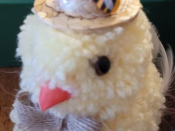 Close-up of a fluffy yellow chick decoration.