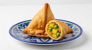 Samosa
Crispy triangular patties stuffed with spiced potatoes and green peas. served with mint and t