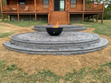 Custom decorative stamped and colored concrete patio with fireplace in Bellville, Ohio