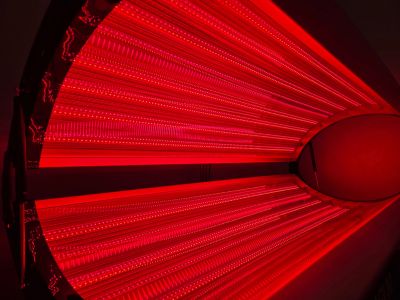 Bright red LED light panel with intricate patterns.