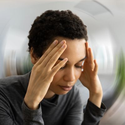 Person experiencing dizziness or headache.