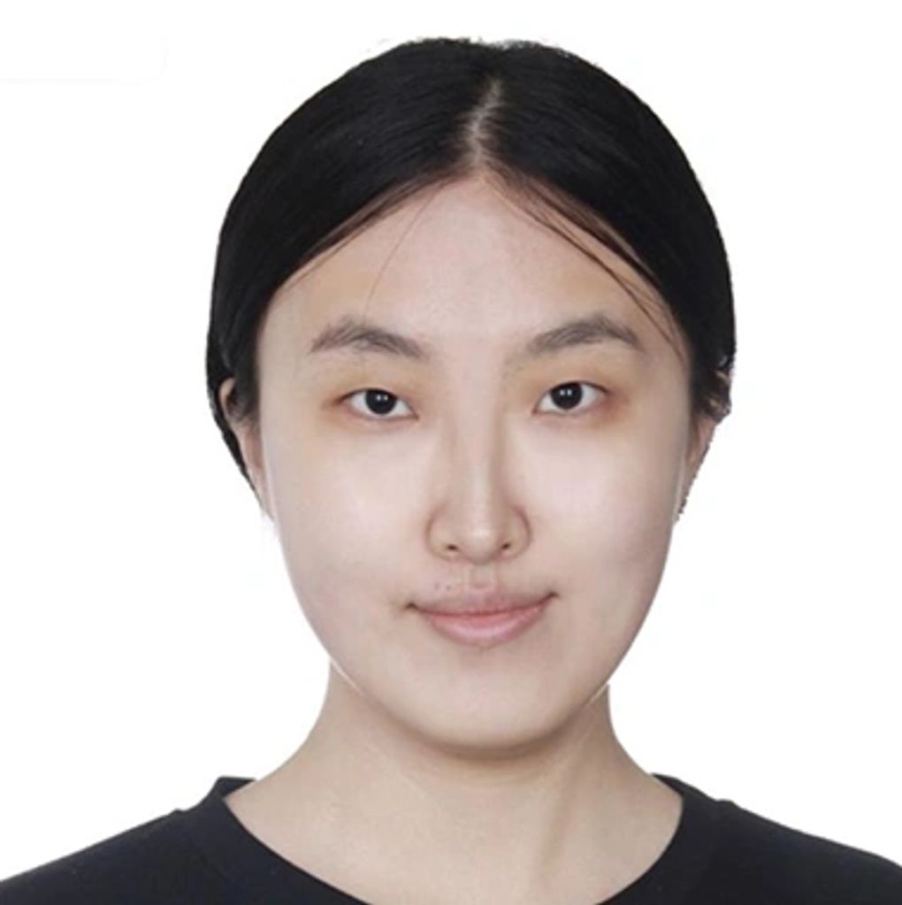 Portrait of a woman with dark hair and a subtle smile.