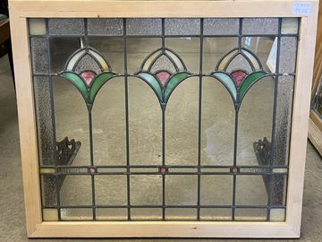 Simple stained and clear glass window in new frame for hanging. Pink and yellow tulips