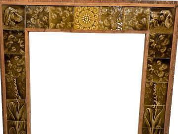 19th century US Encaustic Tile Co. Dog Head and floral pattern fireplace tile surround
