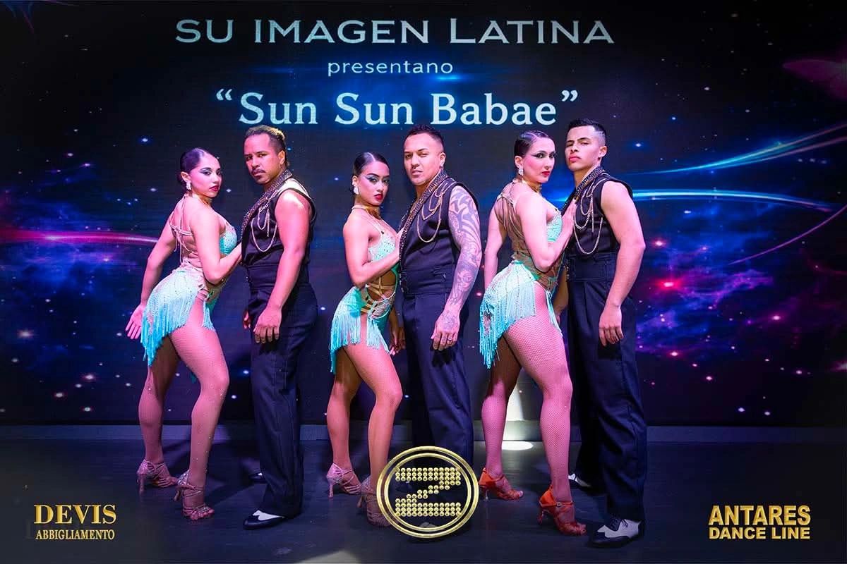 Latin dance group poses in coordinated outfits for 'Sun Sun Babae' performance.