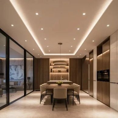 Modern dining room with warm lighting and wood accents.