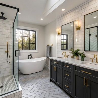 Modern bathroom with freestanding tub, glass shower, and dark cabinetry.