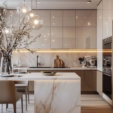 Modern kitchen with marble island, pendant lights, and sleek cabinetry.