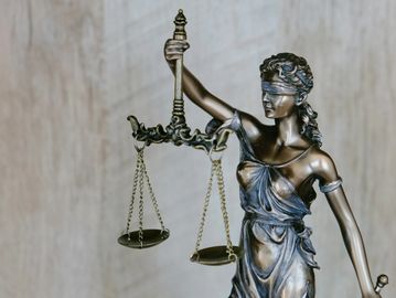 Statue of Lady Justice holding scales.