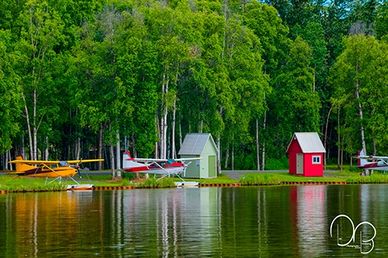 Seaplanes along Lake Hoods shores, a lake used strictly as a watery airport in Anchorage Alaska.