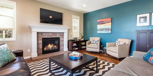 living room with teal wall