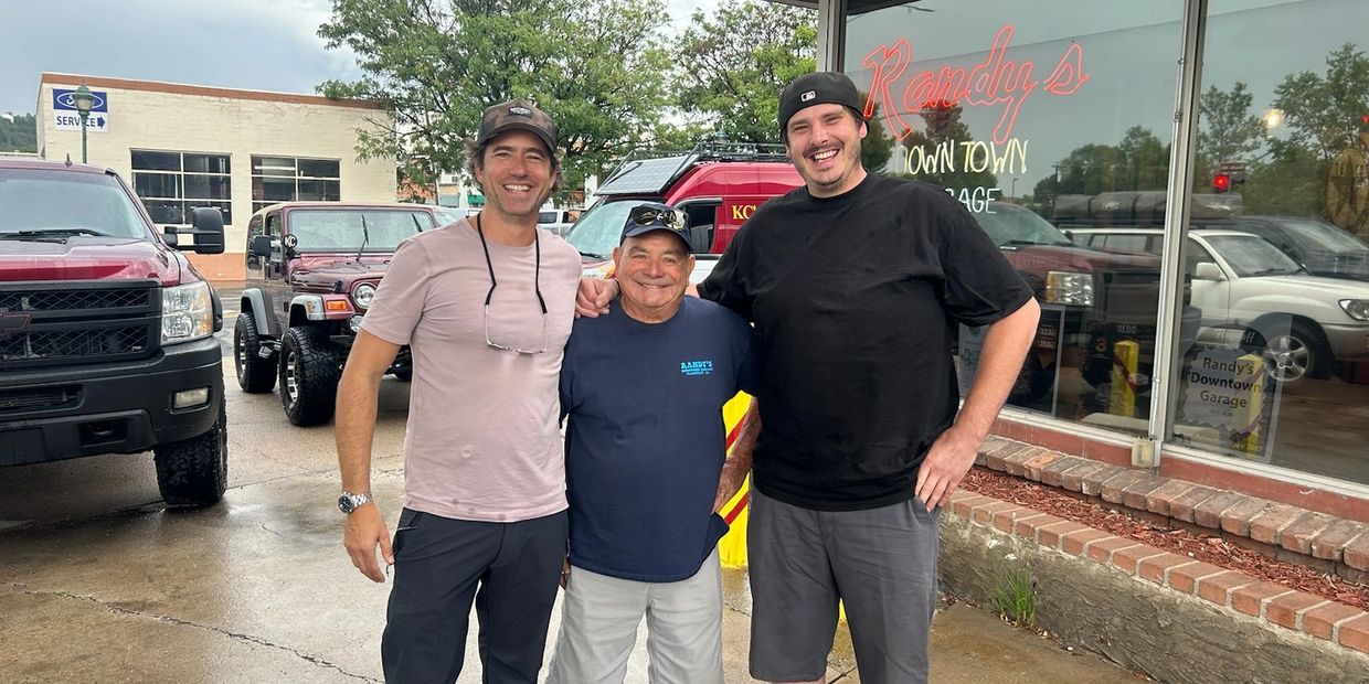 Three Randy's owners all in one photo smiling together. 