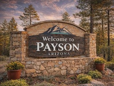 Welcome to Payson Arizona sign surrounded by pine trees in the Rim Country.