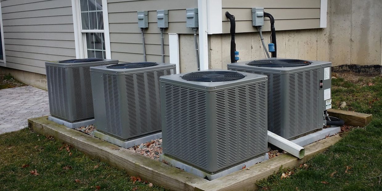 air conditioning condensers on condenser pads