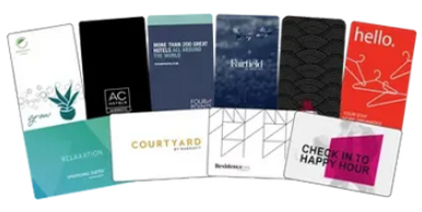 A variety of hotel key cards with diverse designs and branding.