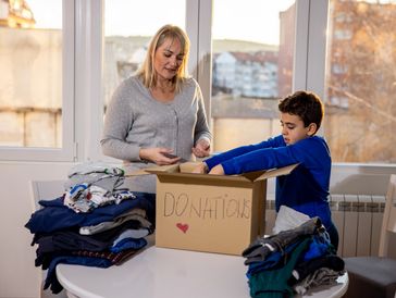Mother and son preparing donation
