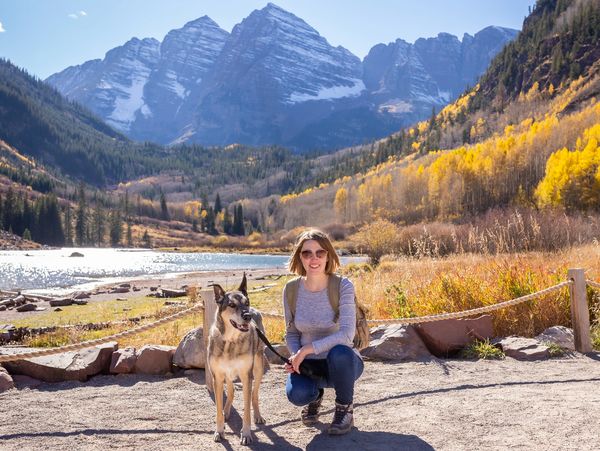 Annelise, owner of Preston Designs Photography, at Maroon Bells with her dog Riley.