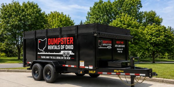 Black dumpster rental trailer with Ohio signage.