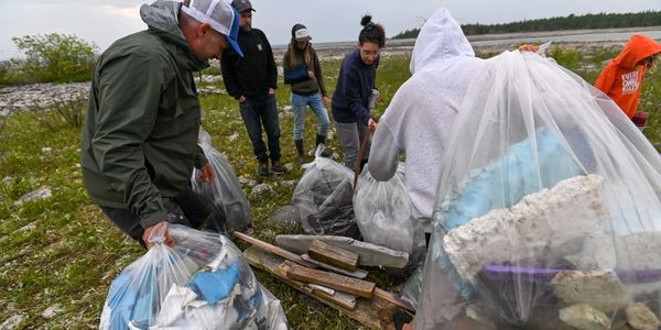 3 Waters Foundation picking up plastic garbage