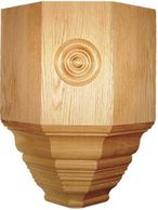 Wooden carved furniture leg with decorative design.
