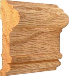 A piece of decorative wooden molding with intricate carved details.