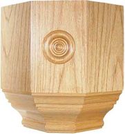 Wooden decorative furniture leg with carved circular detail.