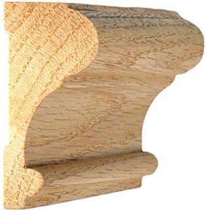 Close-up of a wooden crown molding piece with detailed curves.