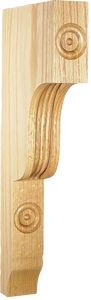 Wooden decorative corbel with carved circular designs.