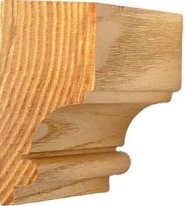 Close-up of a wooden crown molding piece showing detailed grain and profile.
