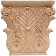 Intricately carved wooden capital with leaf motifs.