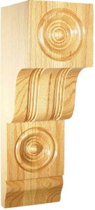 Ornate wooden corbel with circular and scroll designs.