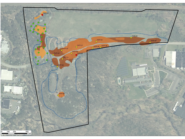 Redevelopment site with delineated fill areas and test pit locations.