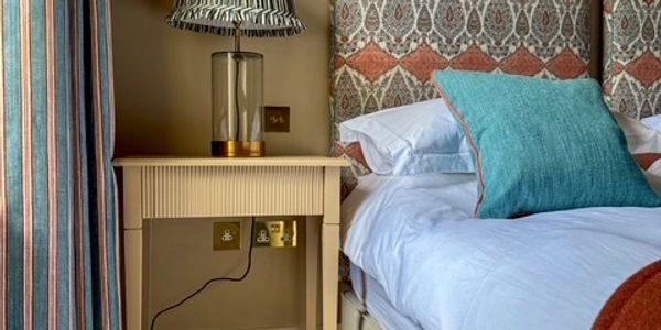 bedroom and dressing table with beautiful lamp, curtain and cushions