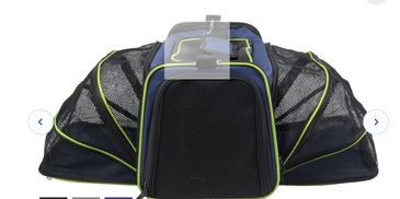 Black and green expandable pet carrier with mesh sides for ventilation.