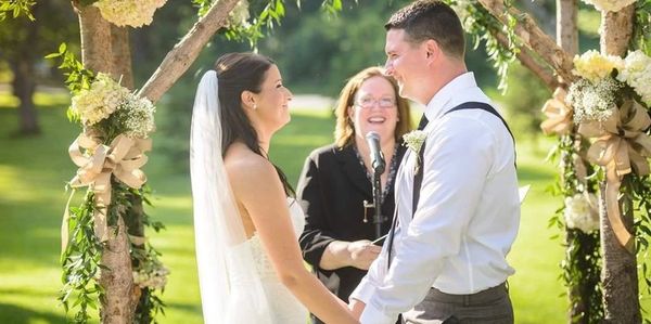 Hudson Valley Officiant Rev. Lisa Zaro with Holly and Matt. Photo by Chris Carter Photography.