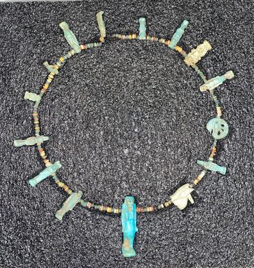 Ancient Egyptian Amulets arranged into a necklace at the Herbert, Coventry