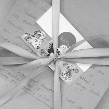 Thank you card and business card wrapped in ribbon