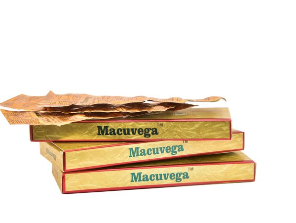 Stack of Macuvega medicine boxes with blister packs on top.