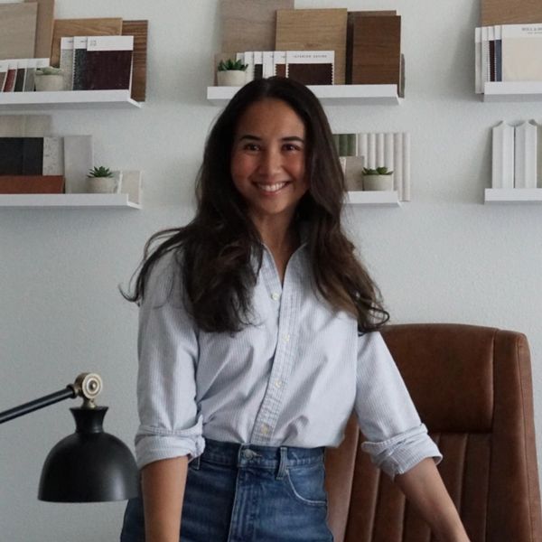 Woman smiling in a stylish office.