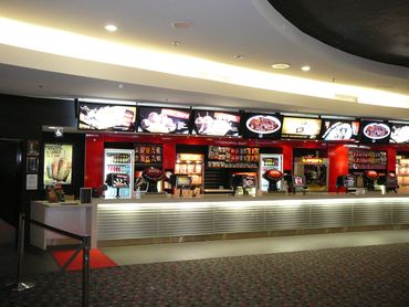 A movie theater concession stand with snacks and drinks.