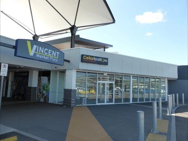Shopping center entrance with Vincent Market Place and Cellarbrations.