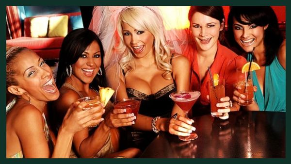 Group of women celebrating with cocktails at a party.