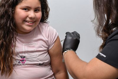 Pediatric child receiving an immunization