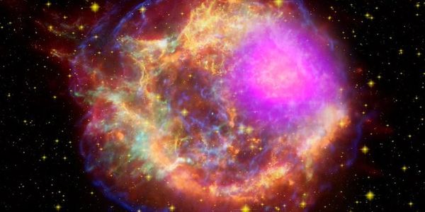Colorful supernova remnant glowing in space with stars.