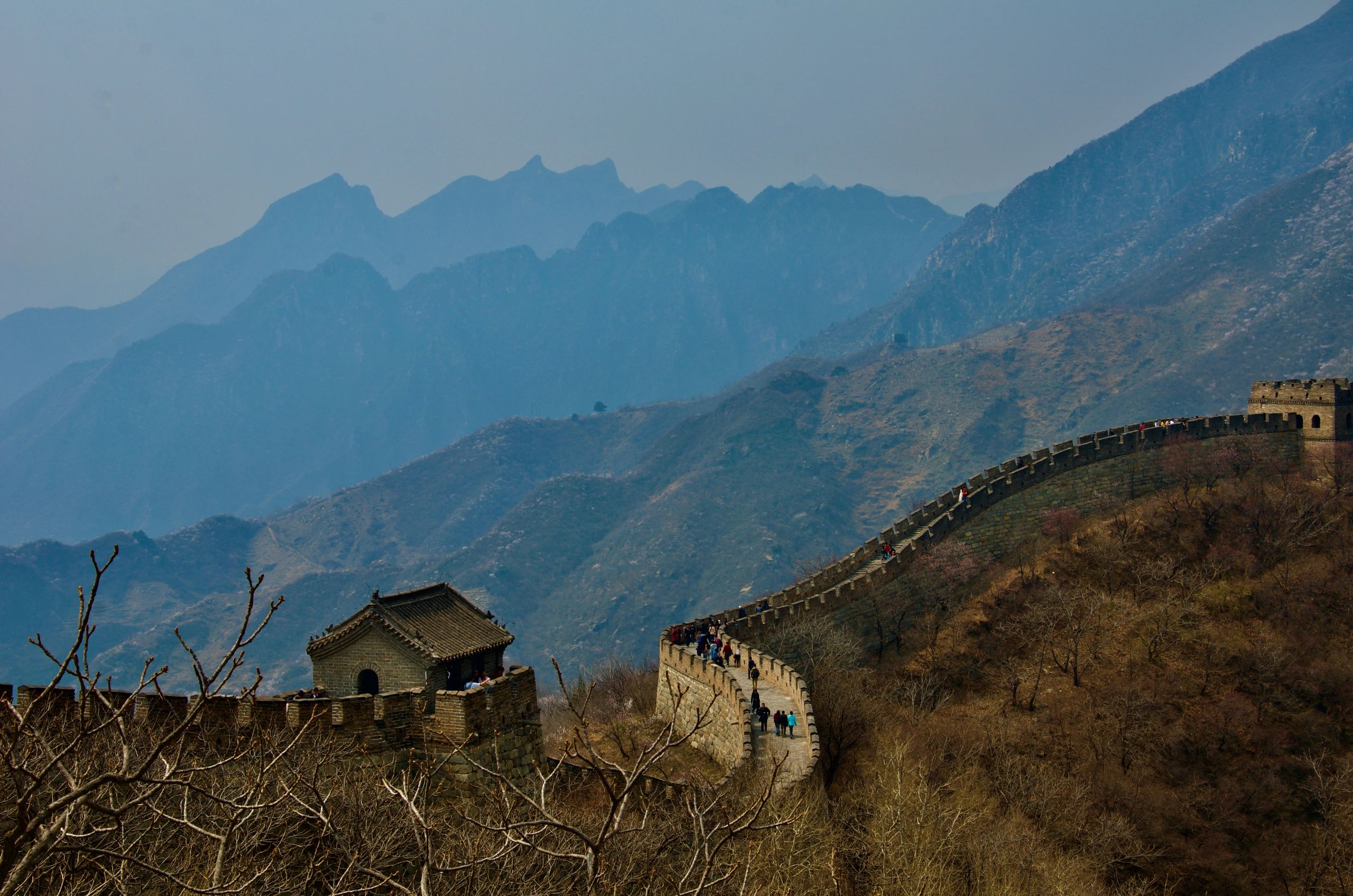 The Great Wall of China winding through misty mountains.