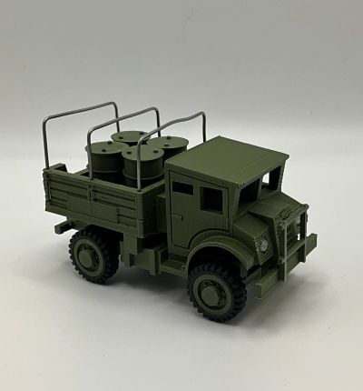 Green military truck model with barrels in the back.