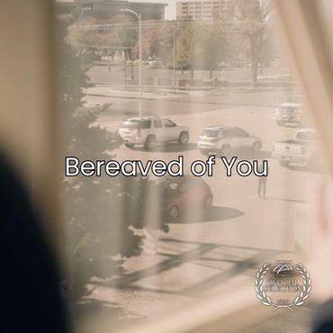 View through window shows a parking lot with the text 'Bereaved of You'.