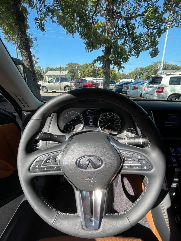 A car with the steering wheel turned down.