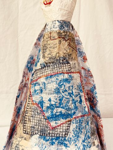 Artistic dress with map and grid patterns.